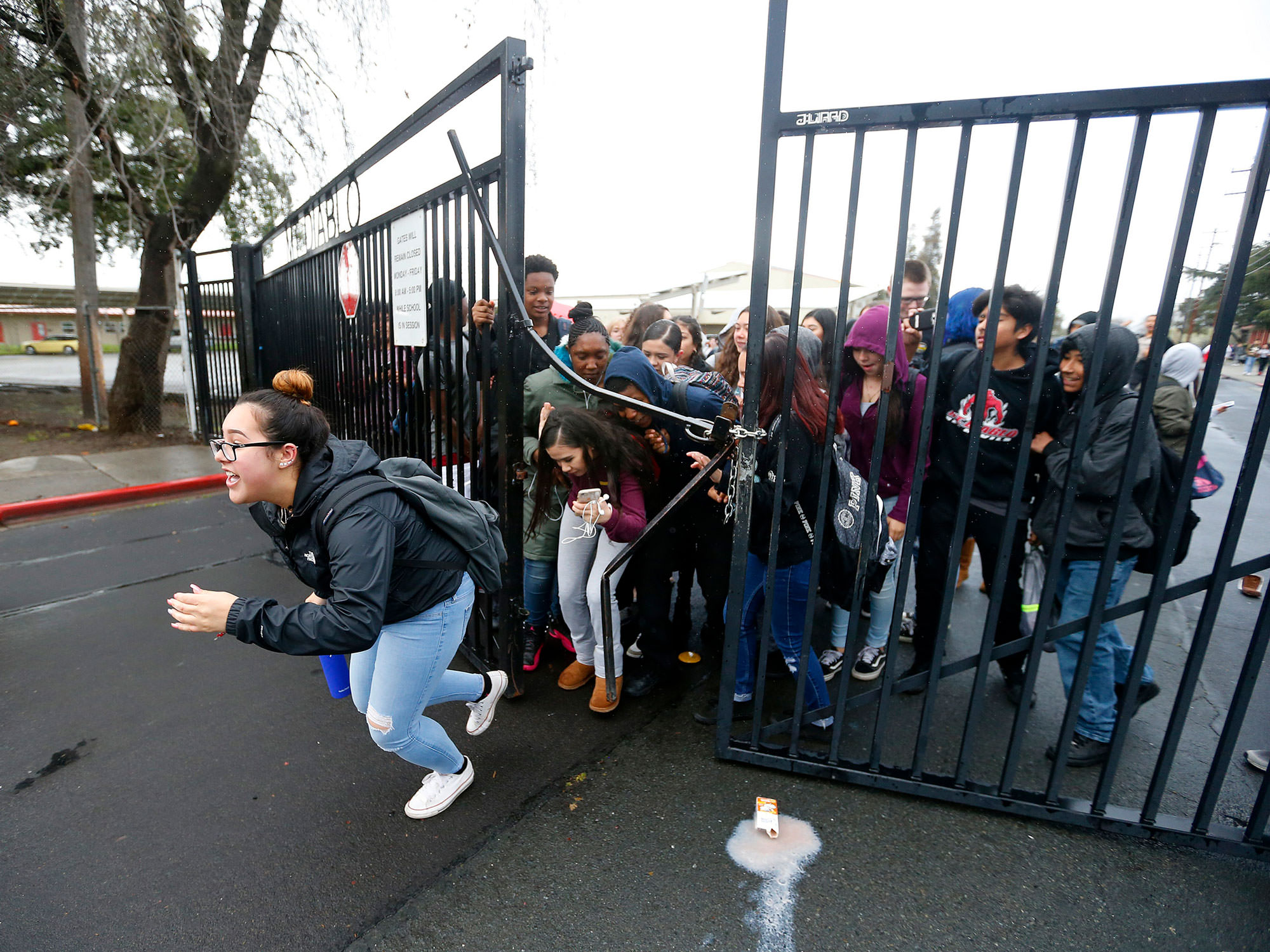 Students at Concord’s Mt. Diablo High break through gate in gun protest.